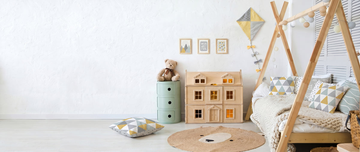Playful room of a child with pillows and print arts on the wall.